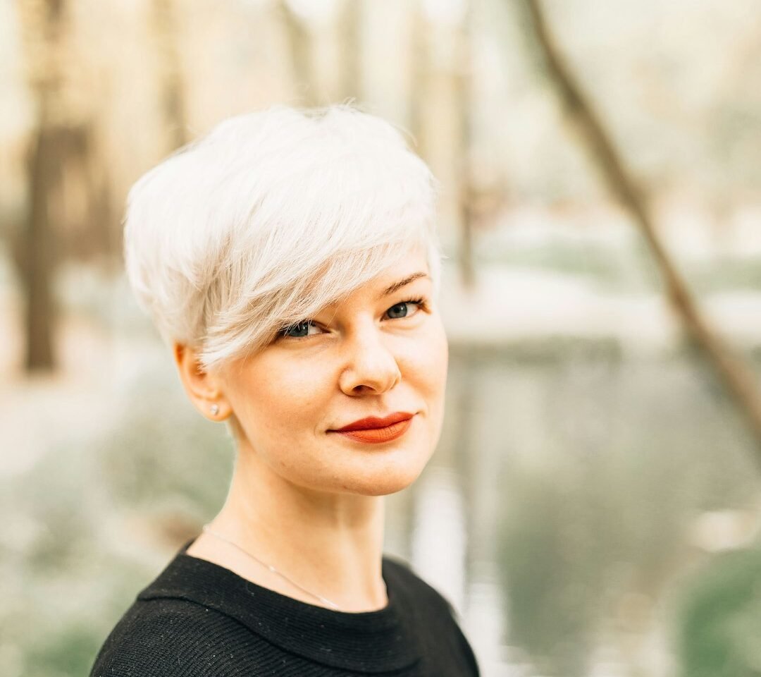 Woman with a short pixie-style haircut, used as fine-hair haircut inspiration