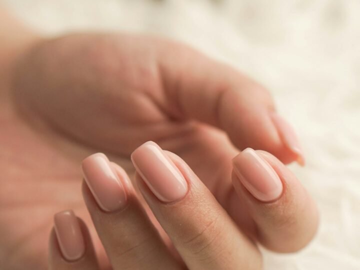 Hands showing a polished manicure, used as simple nail design inspiration