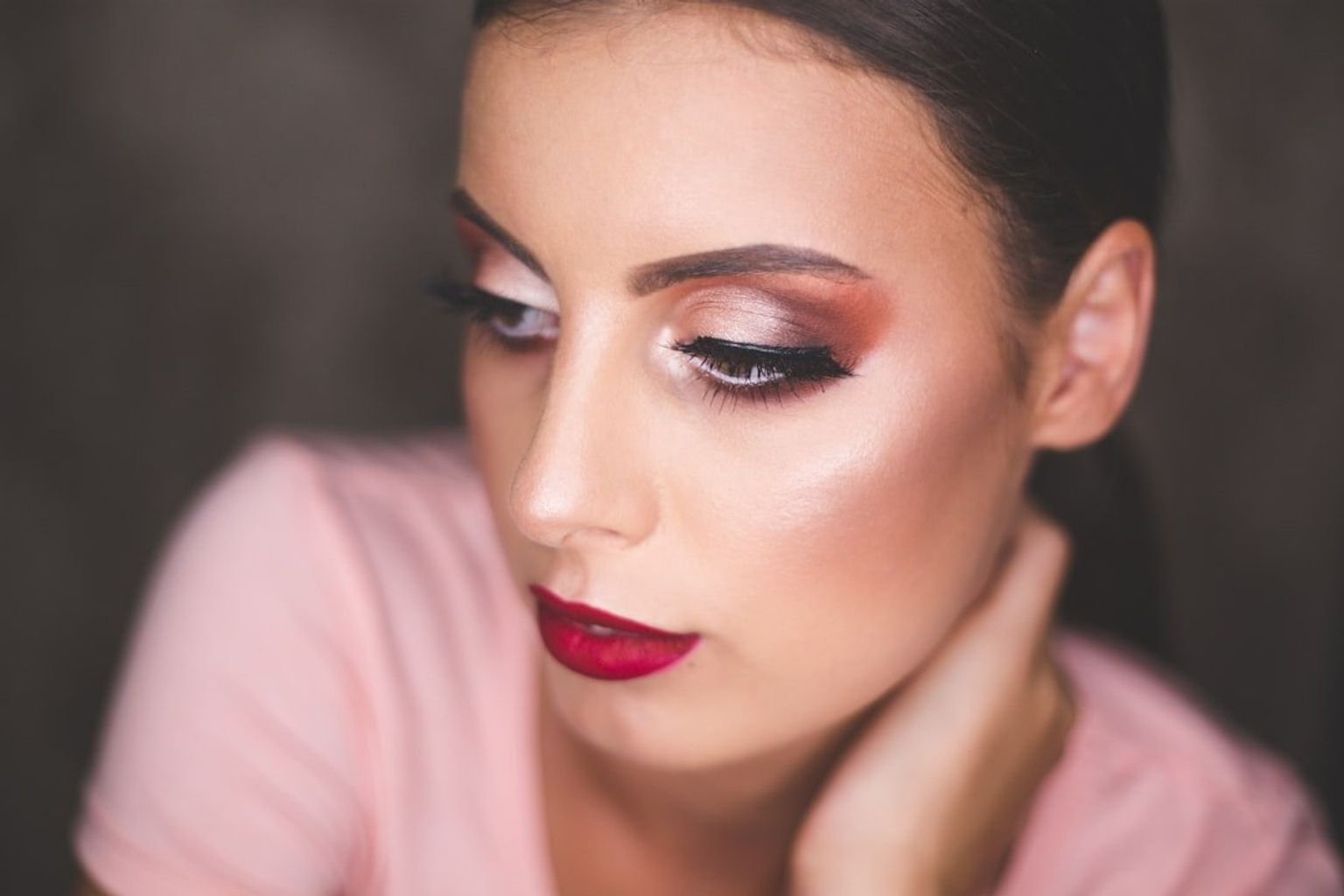 Close-up portrait with luminous skin and softly controlled shine across the face