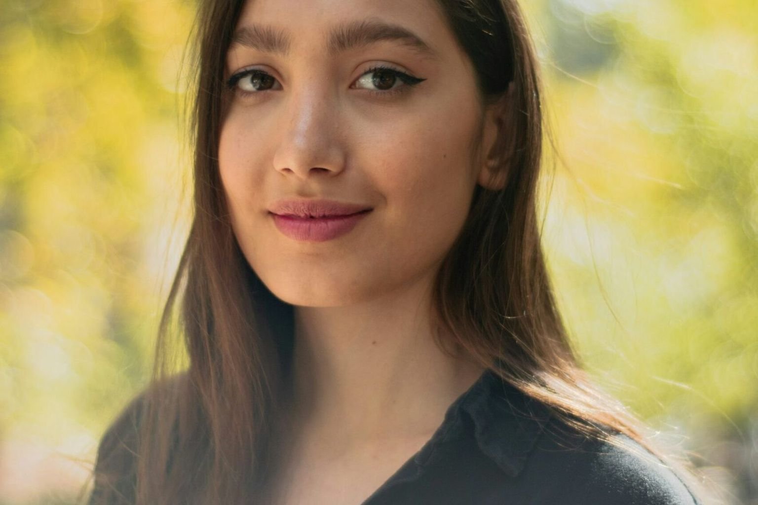 Natural-looking complexion with light polished makeup and visible skin texture