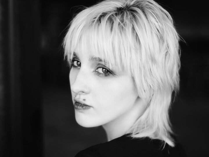 Short softly layered haircut showing the transitional shape between a pixie and a bob