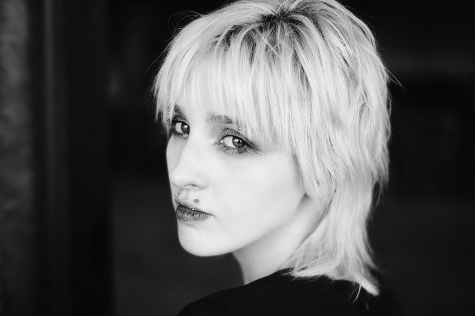 Short softly layered haircut showing the transitional shape between a pixie and a bob