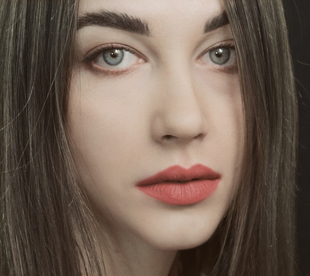 Close beauty portrait with eye and lip makeup visible