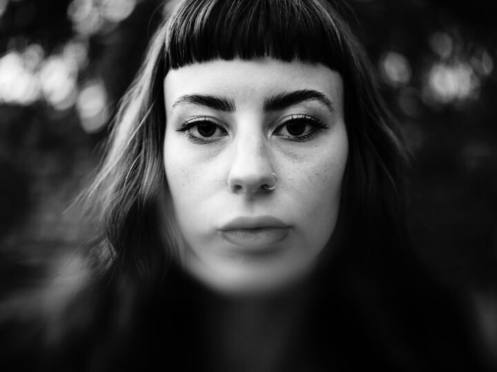 Woman with a visible fringe and natural front hairline