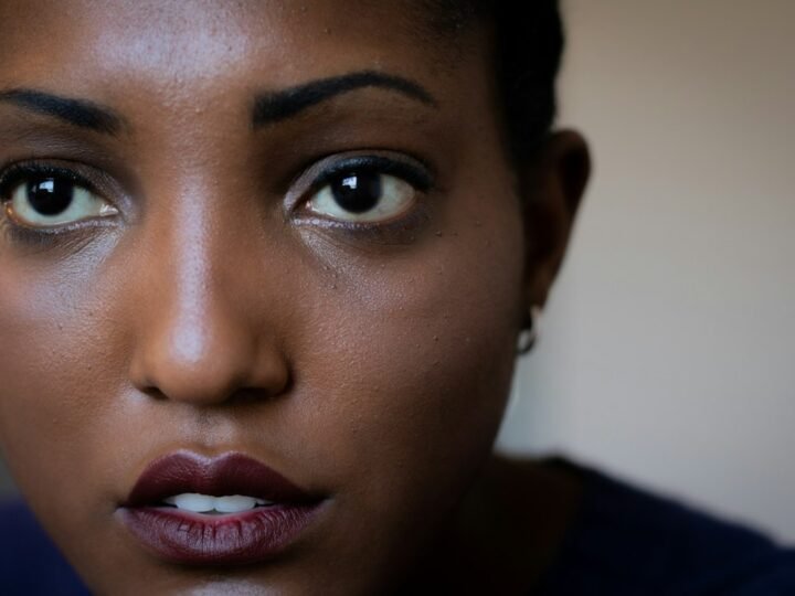 Close portrait with natural facial definition and minimal styling
