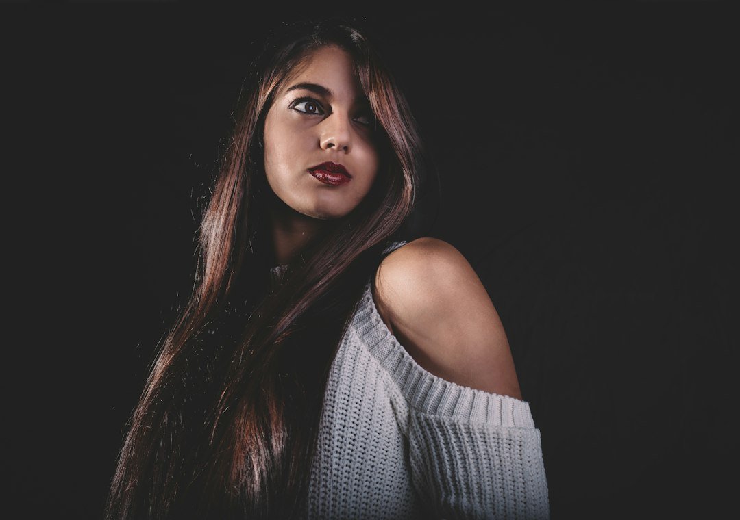 Woman with glossy brunette hair showing rich tonal color