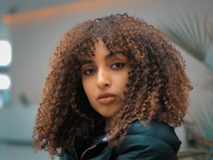 Woman with curly hair showing soft volume around the face
