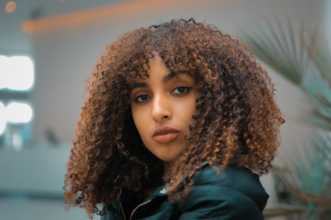 Woman with curly hair showing soft volume around the face