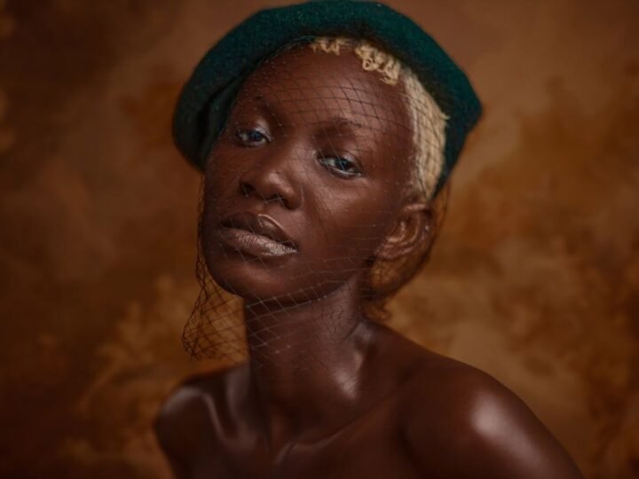 Soft earth-tone eye makeup blended as a single neutral wash across the lids
