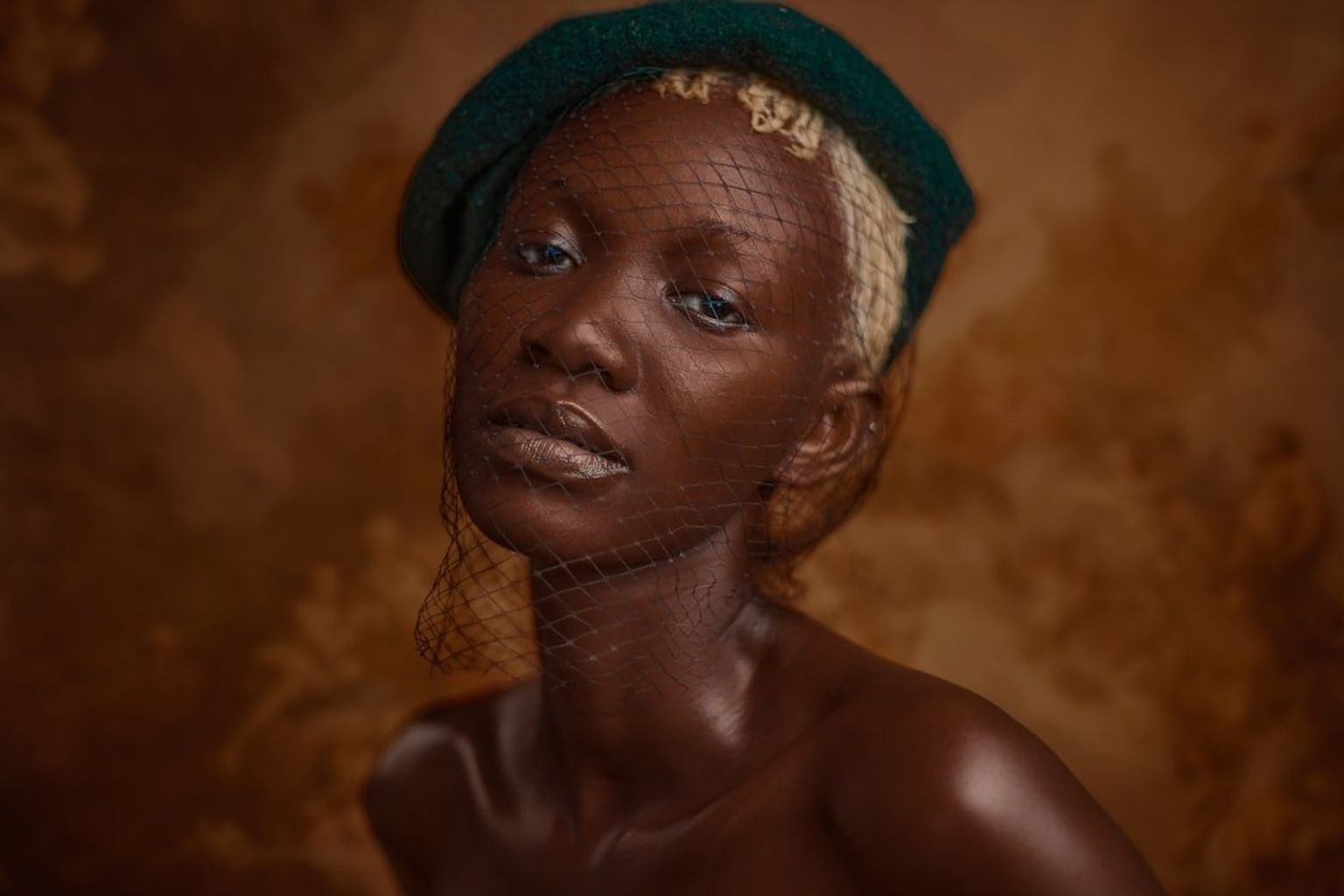 Soft earth-tone eye makeup blended as a single neutral wash across the lids