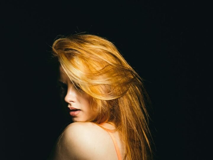 Portrait with warm-toned hair and glossy visible lengths