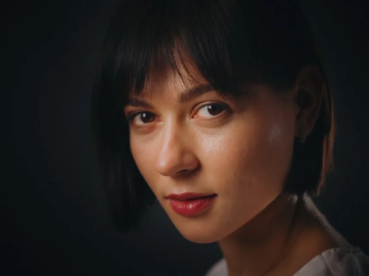 Woman with a short layered haircut at a longer pixie grow-out length