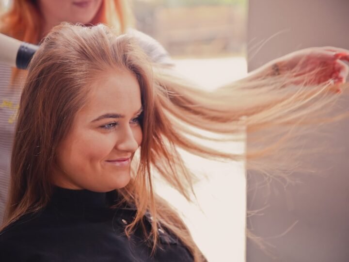 Salon blow-dry with hair color and shine visible through the lengths