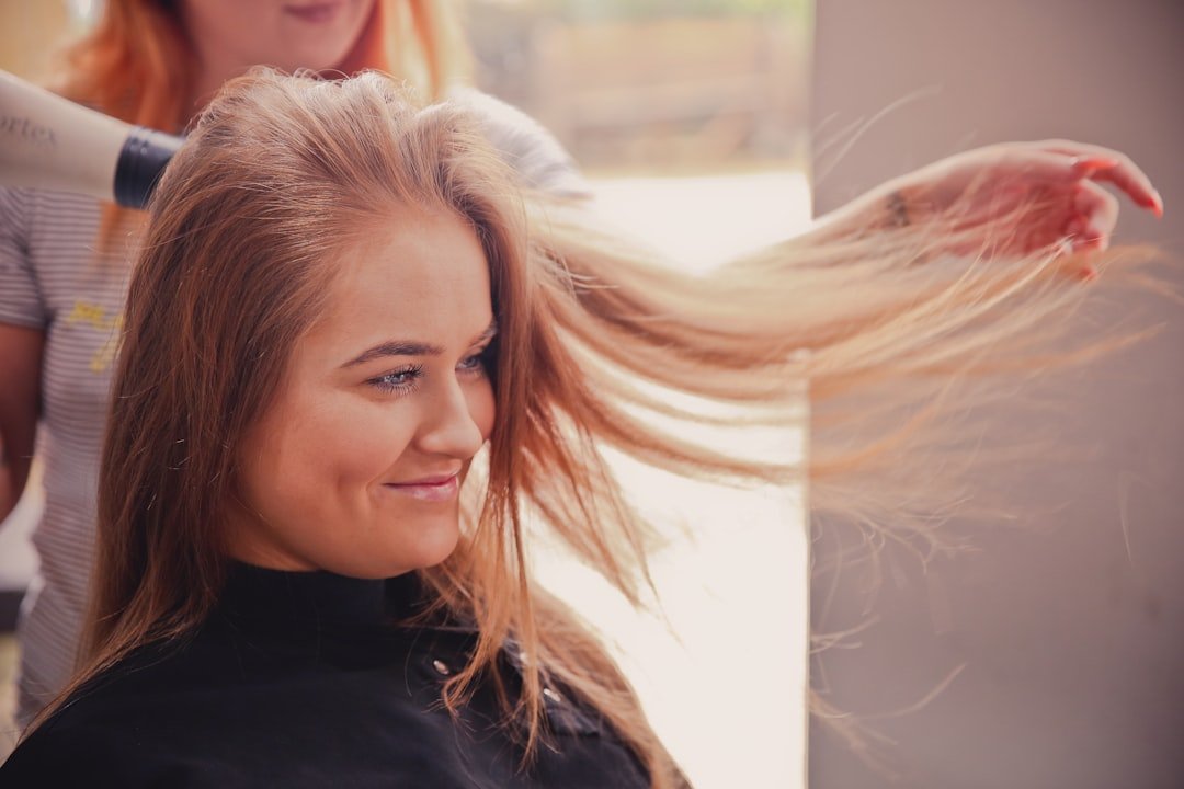 Salon blow-dry with hair color and shine visible through the lengths