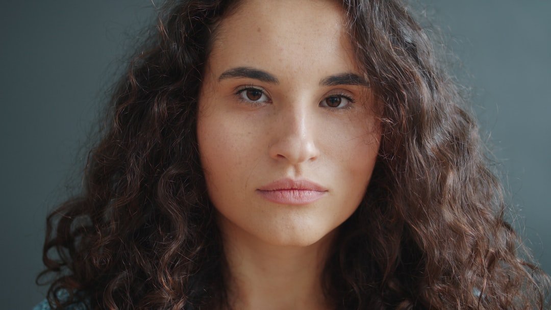 Portrait with textured curly hair and visible face-framing shape