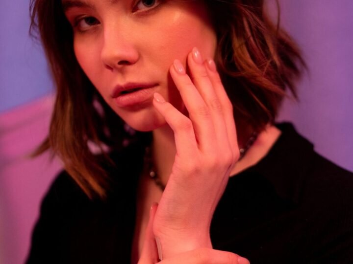Brunette with a soft bob haircut in warm light