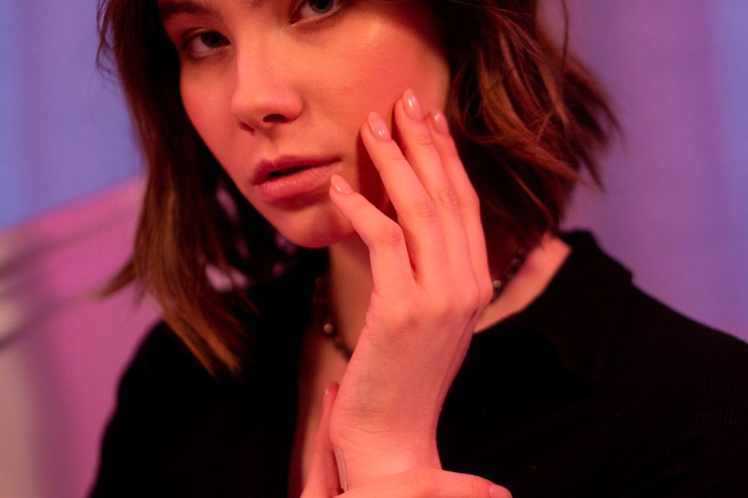 Brunette with a soft bob haircut in warm light
