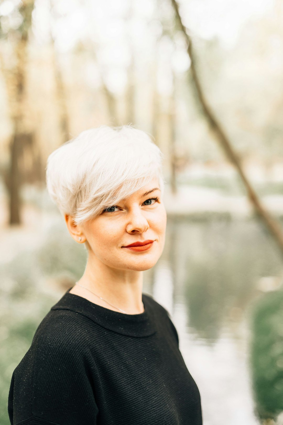 Woman with a short textured pixie-style haircut showing piecey crown movement