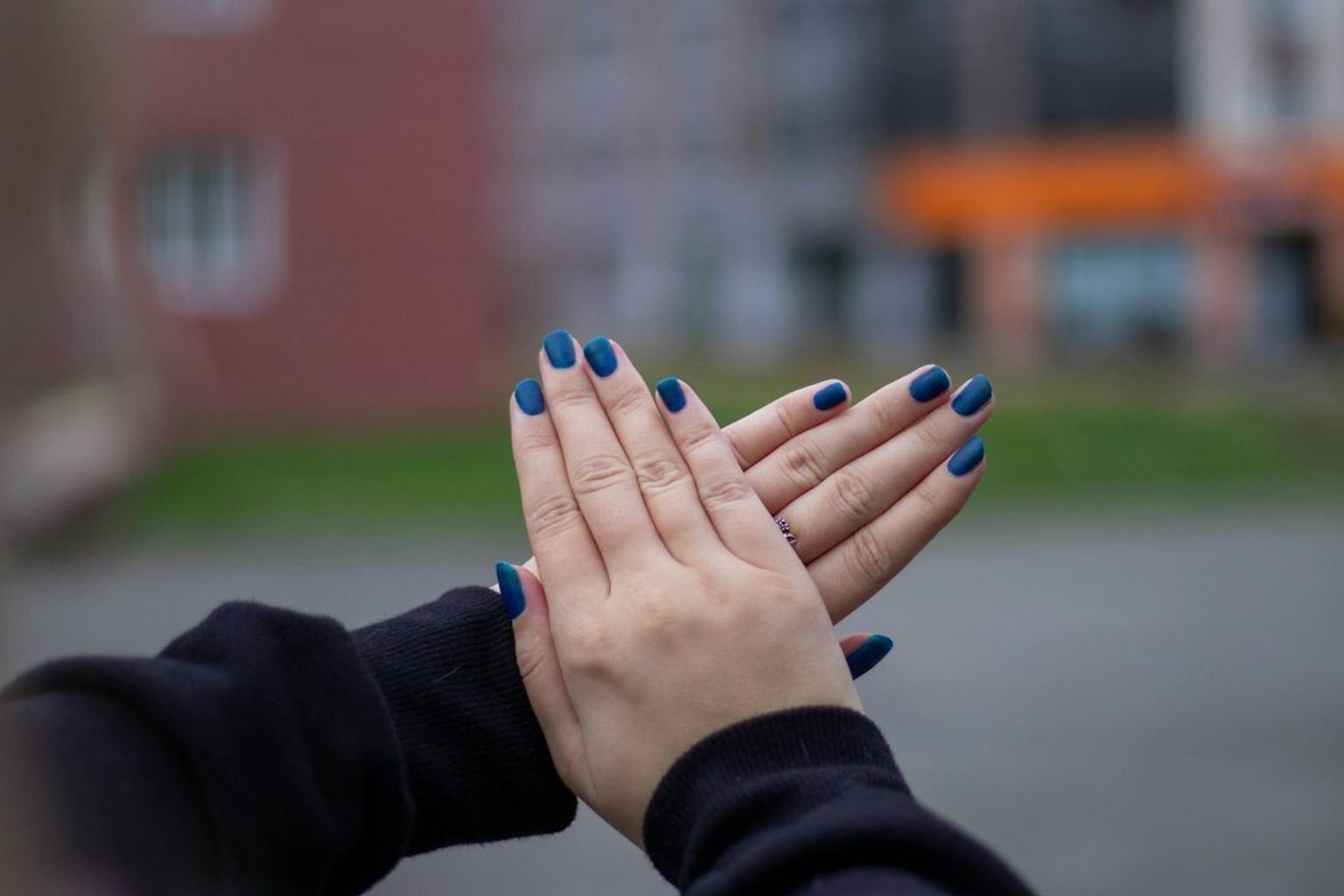 Short natural nails with a glossy saturated sapphire-blue manicure