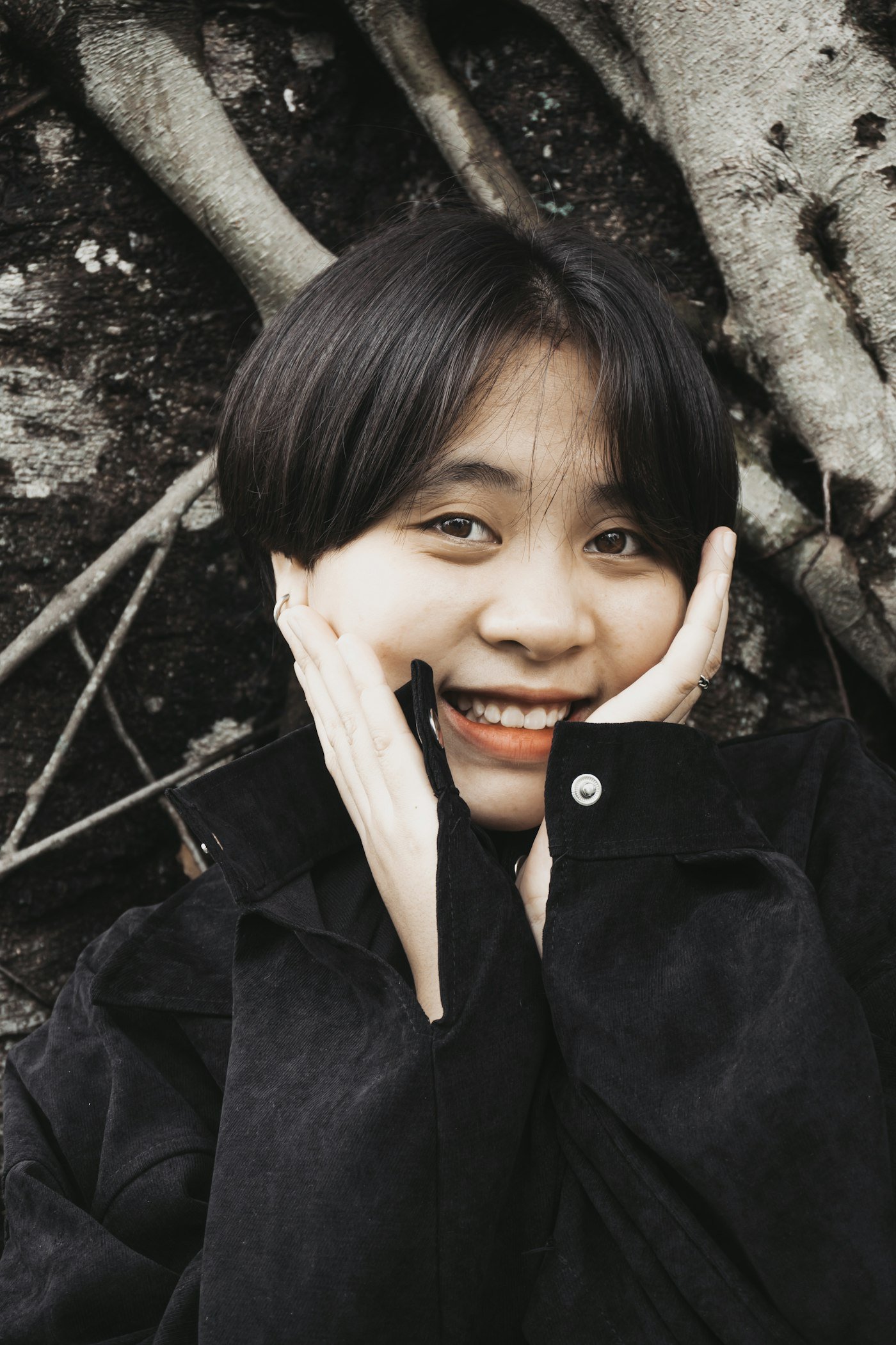 Woman with a short textured hairstyle showing piecey movement through the top and fringe