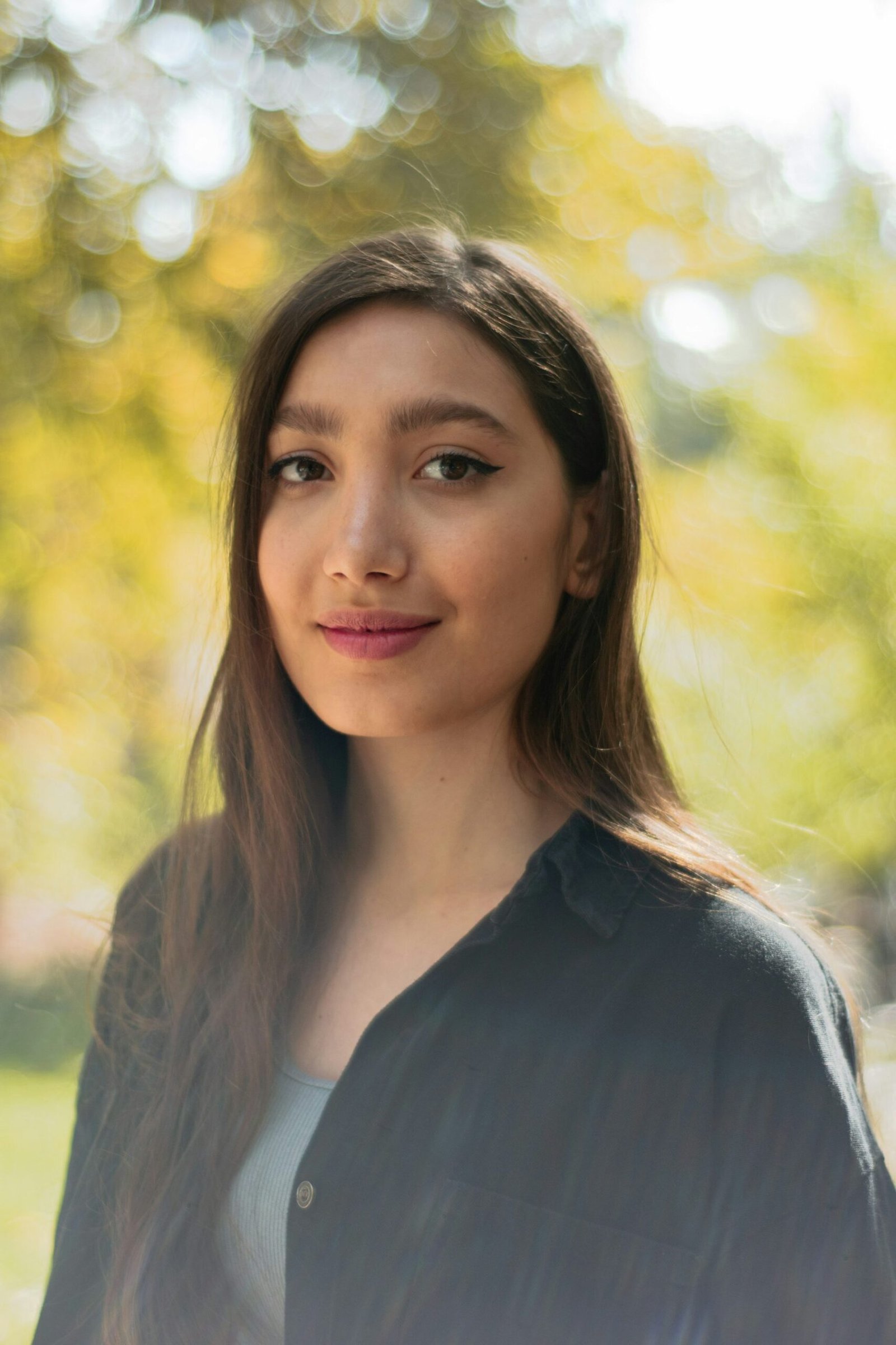 Woman with natural-looking skin and minimal polished makeup