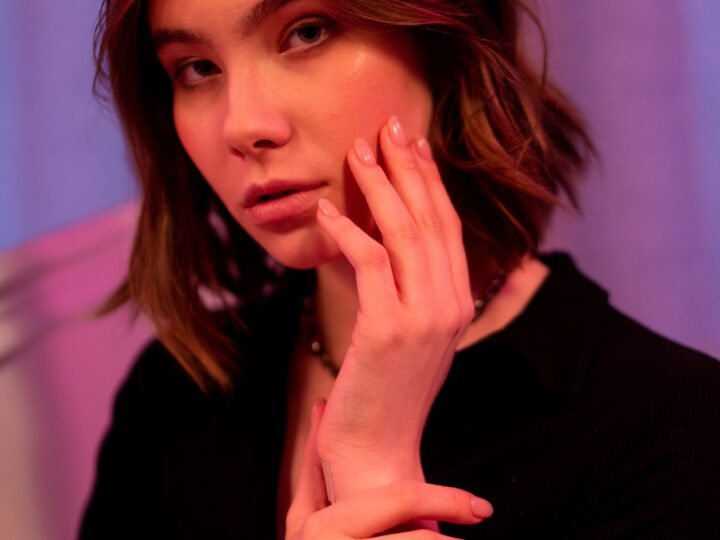 Brunette with a soft bob haircut in warm light
