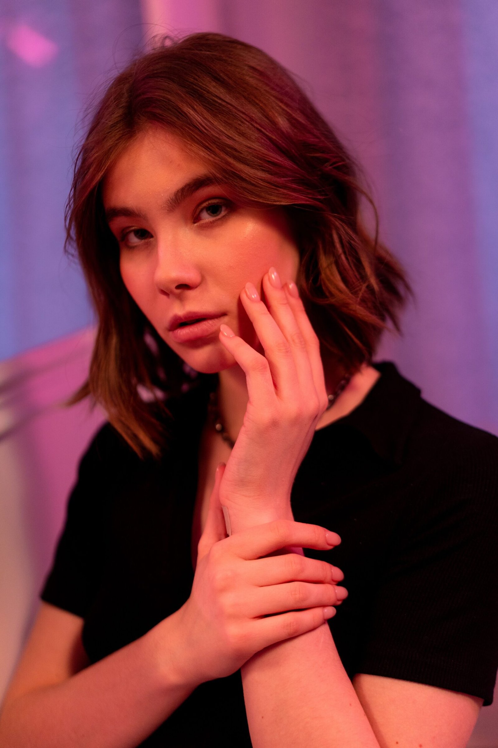 Brunette with a soft bob haircut in warm light