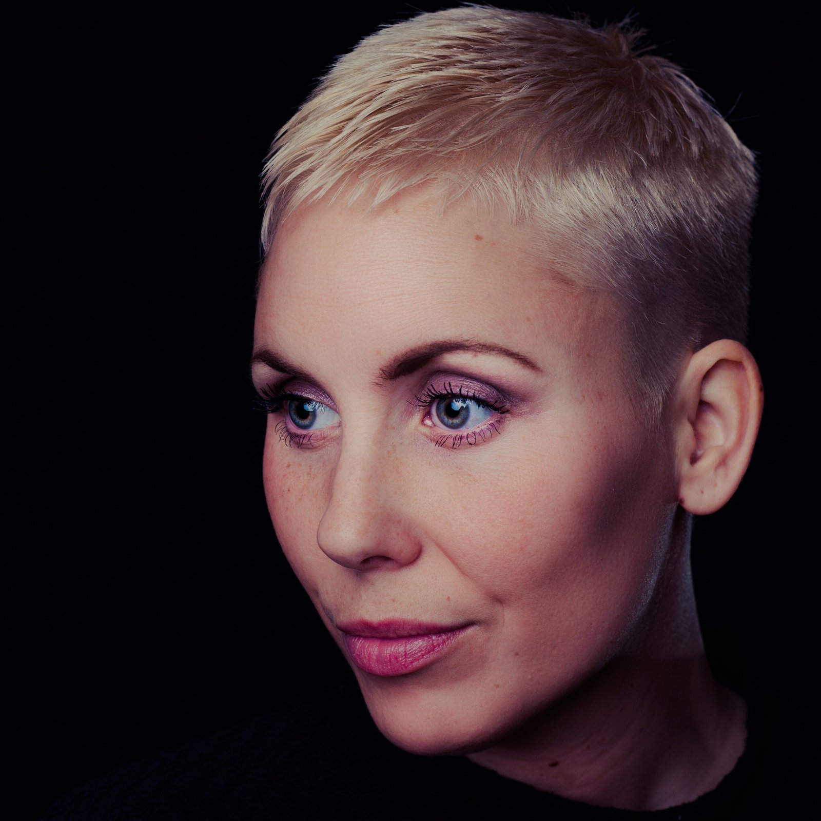 Short blonde crop with soft textured top and close-cut sides