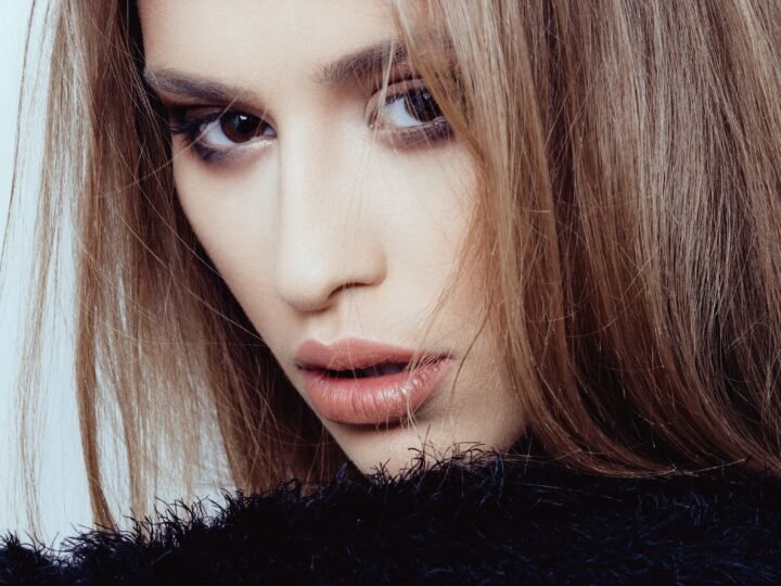 Long warm brunette hair with a glossy dimensional finish