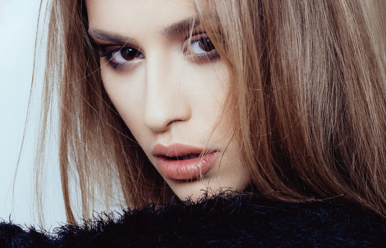 Long warm brunette hair with a glossy dimensional finish