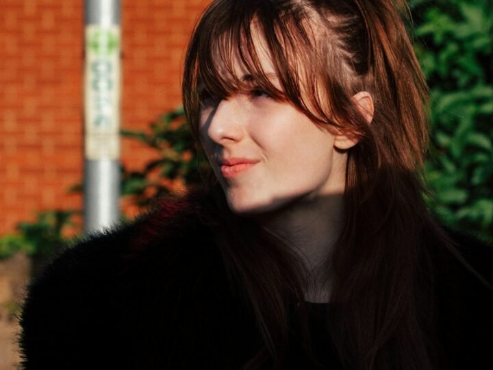 Woman with soft wispy bangs in natural light
