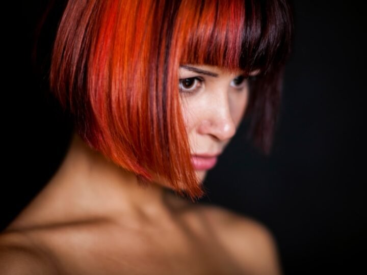 Portrait with rich red hair showing warm tonal depth